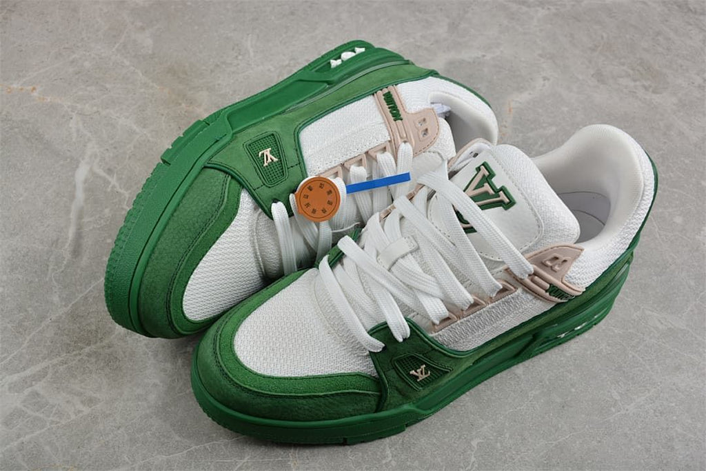 Pair of green and white low-top sneakers viewed from above