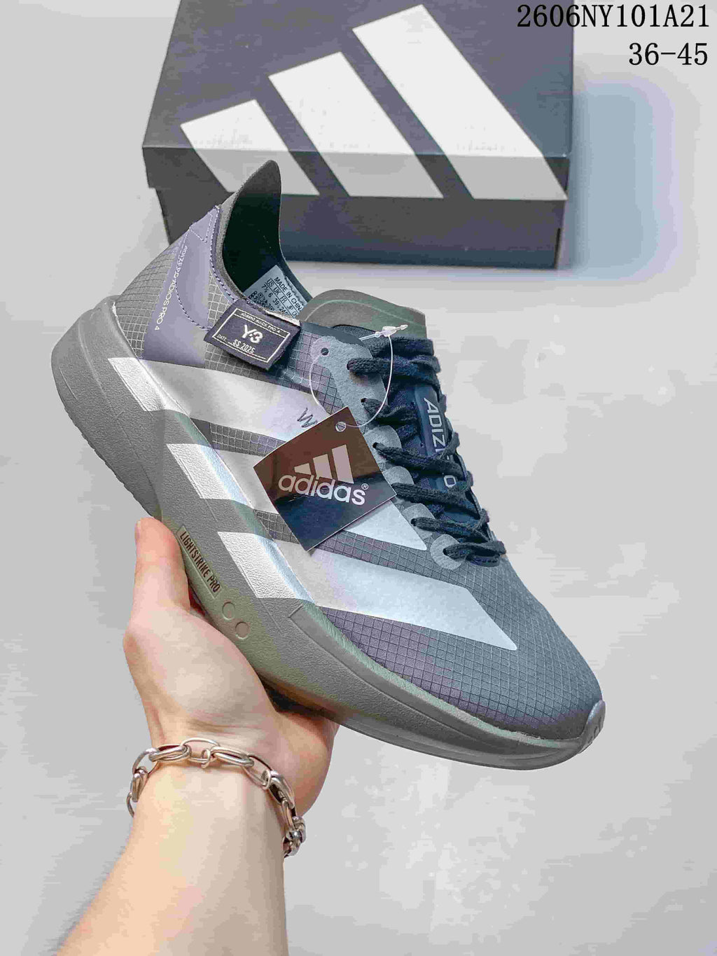 Gray Adidas running shoe with light-colored stripes and Lightstrike Pro sole; image text shows 36–45.