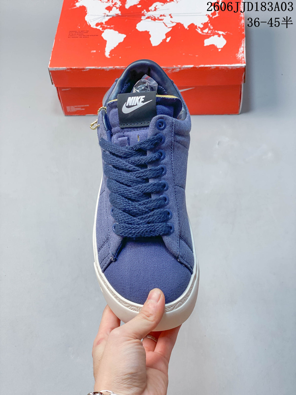 Front view showing the laces and toe of the blue sneaker