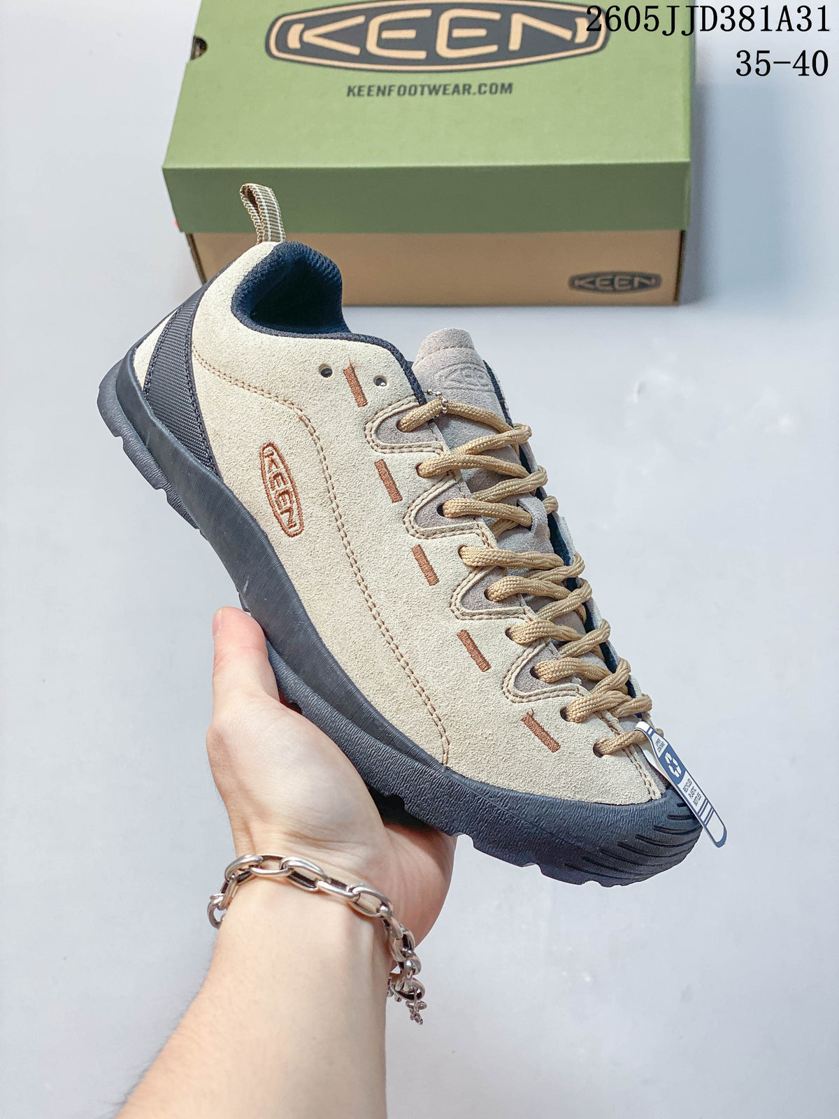 Angled side view highlighting the sneaker's beige upper and navy sole