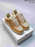 Tan and cream low-top sneakers with woven-look panels and contrasting overlays