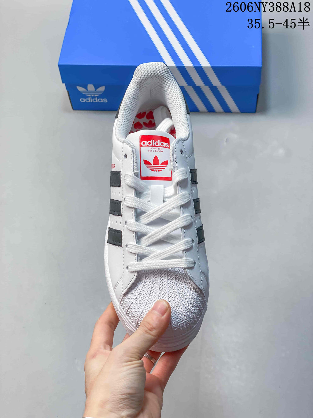 Top view showing the laces and textured shell toe of a Superstar sneaker