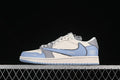 Side view of a grey and blue low-top sneaker with a pale midsole