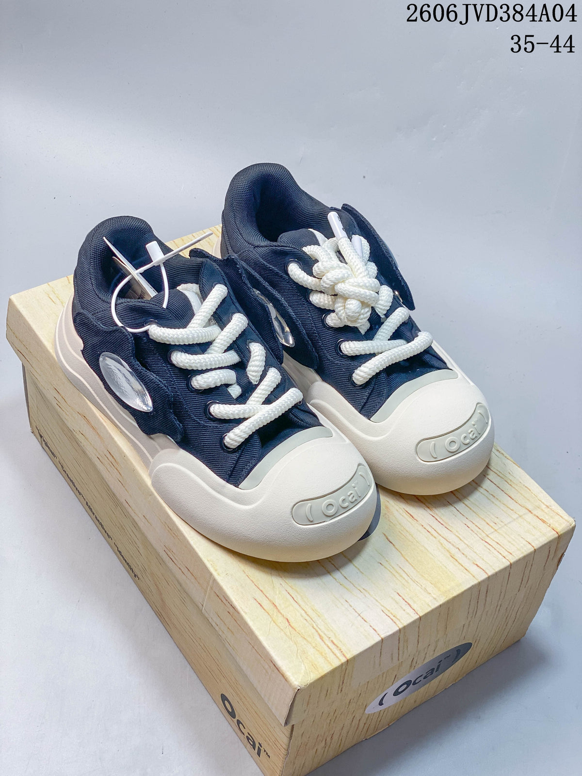 Navy Ocai sneakers with rope-style laces and cream-colored soles