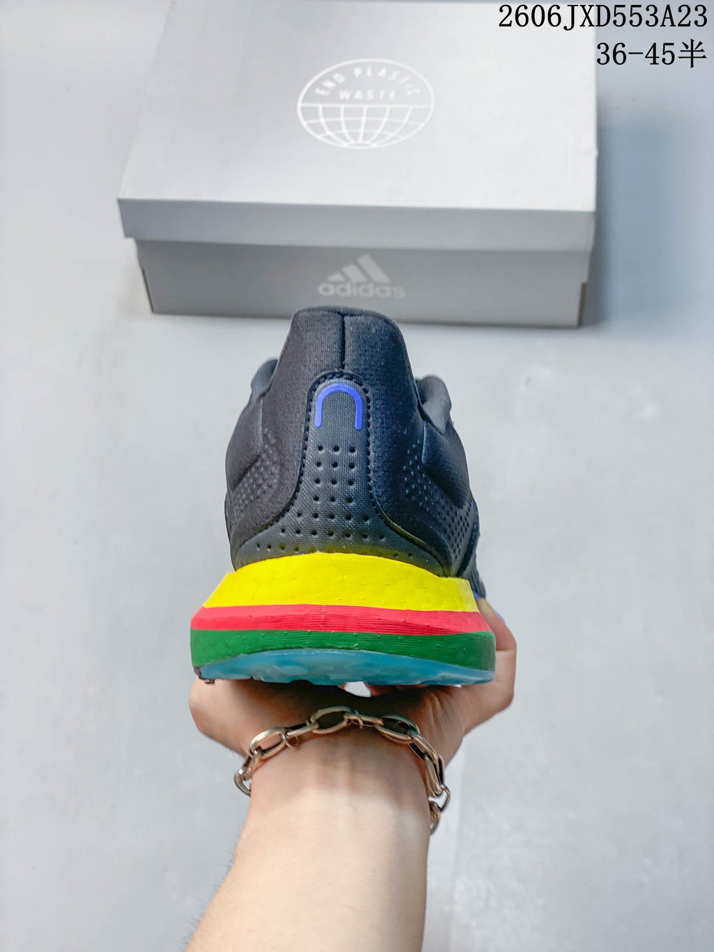 Rear view showing yellow, red, green, and blue sole accents