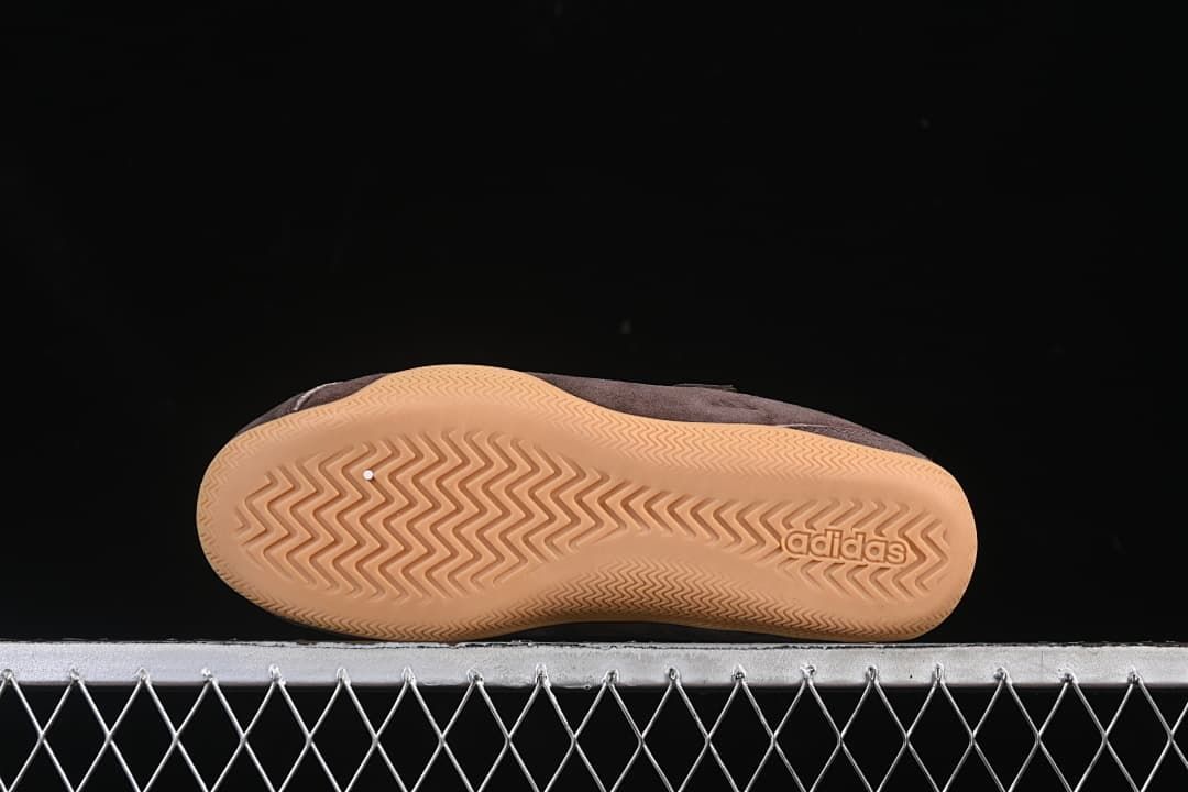 Underside view showing the patterned gum-colored outsole.
