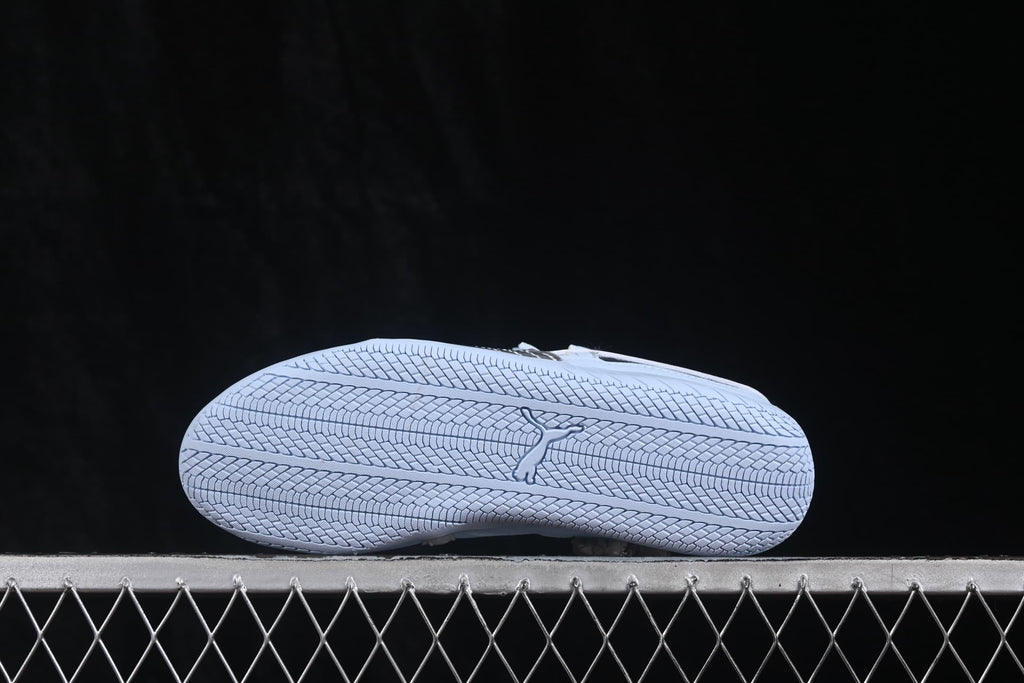 Bottom view showing the textured rubber outsole and central Puma branding.