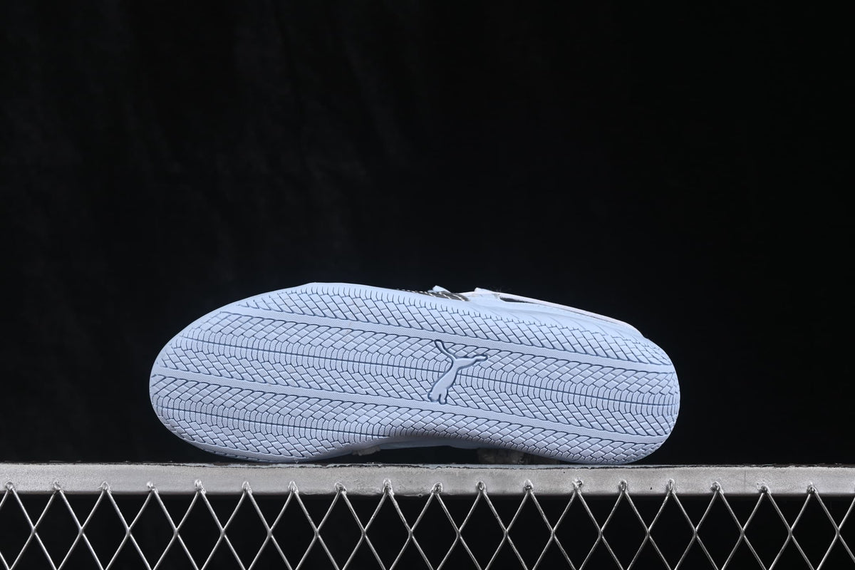 Bottom view showing the textured rubber outsole and central Puma branding.