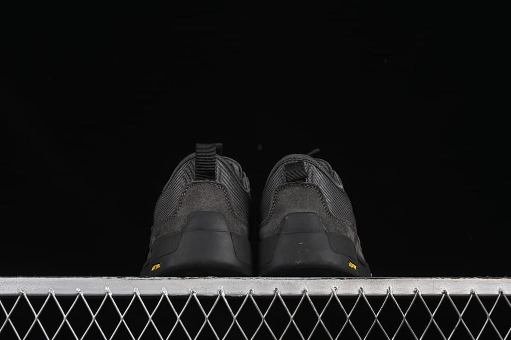 Rear view of both sneakers showing heel pull tabs