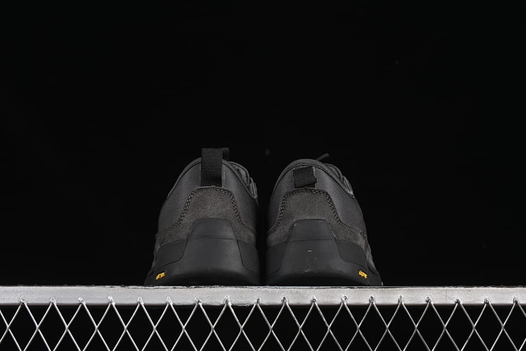 Rear view of both sneakers showing heel pull tabs