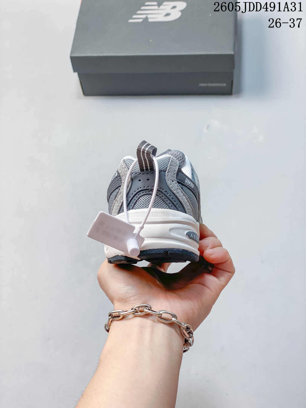 Rear view of a gray New Balance kids' sneaker