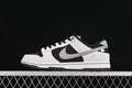 Side profile of a black, white, and grey Nike SB Dunk Low sneaker