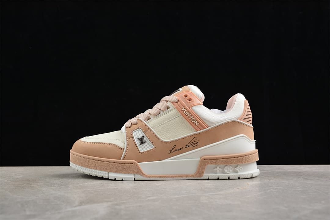 Side profile of the sneaker in ivory white and soft pink