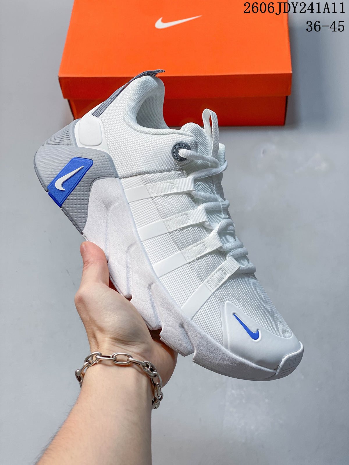 White and gray Nike Free Metcon 7 training shoe with blue accents.