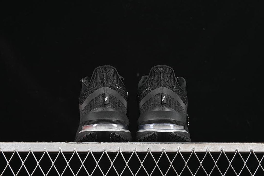 Rear view of both shoes showing the heels and midsoles.