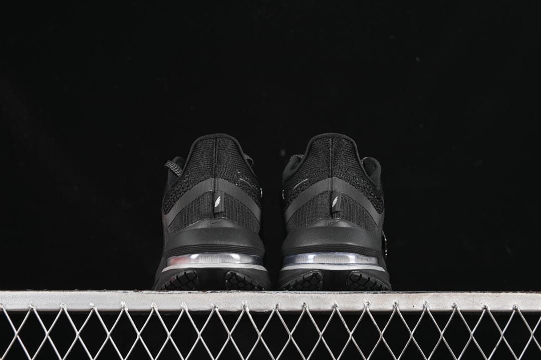 Rear view of both shoes showing the heels and midsoles.