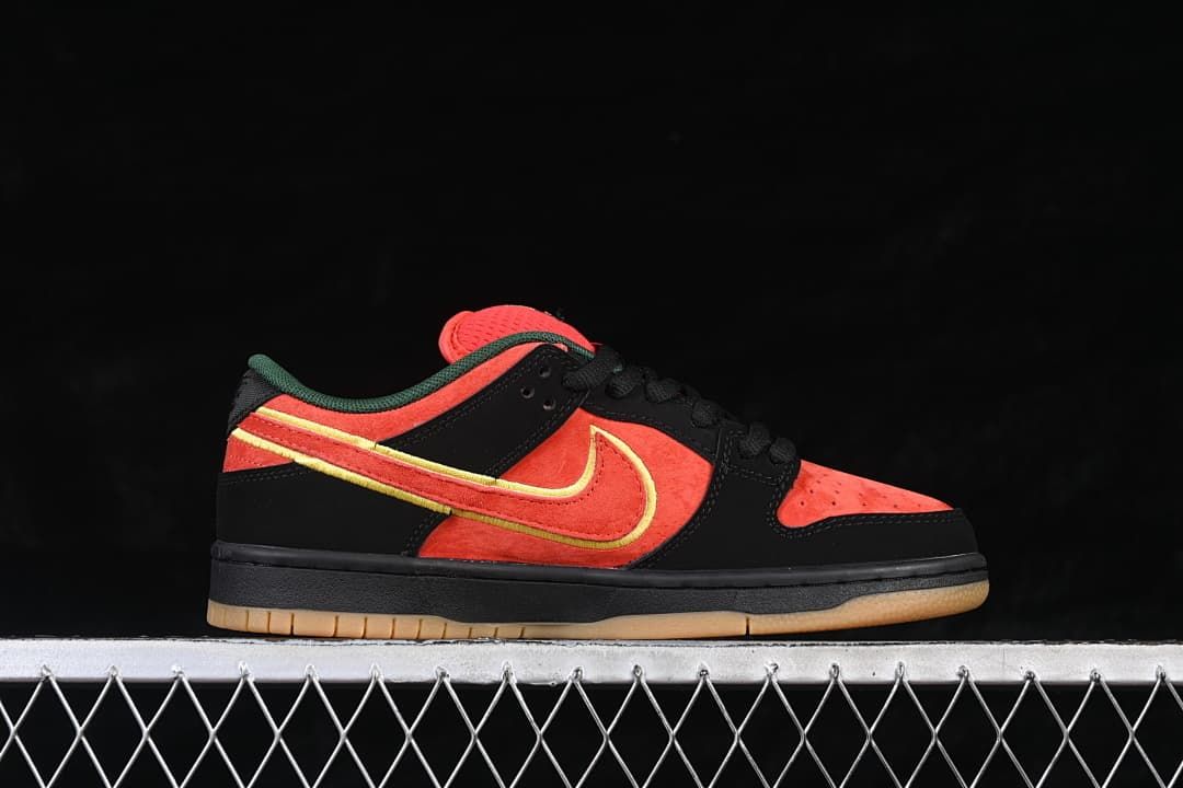 Lateral profile of a single low-top sneaker with red-orange and black panels, yellow-edged Swoosh, and gum outsole.