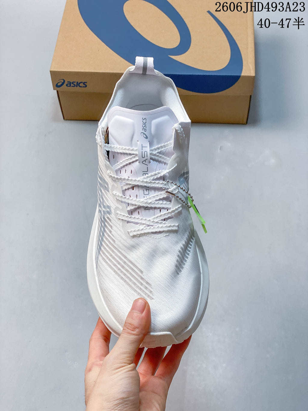 Top view of a white lace-up running shoe