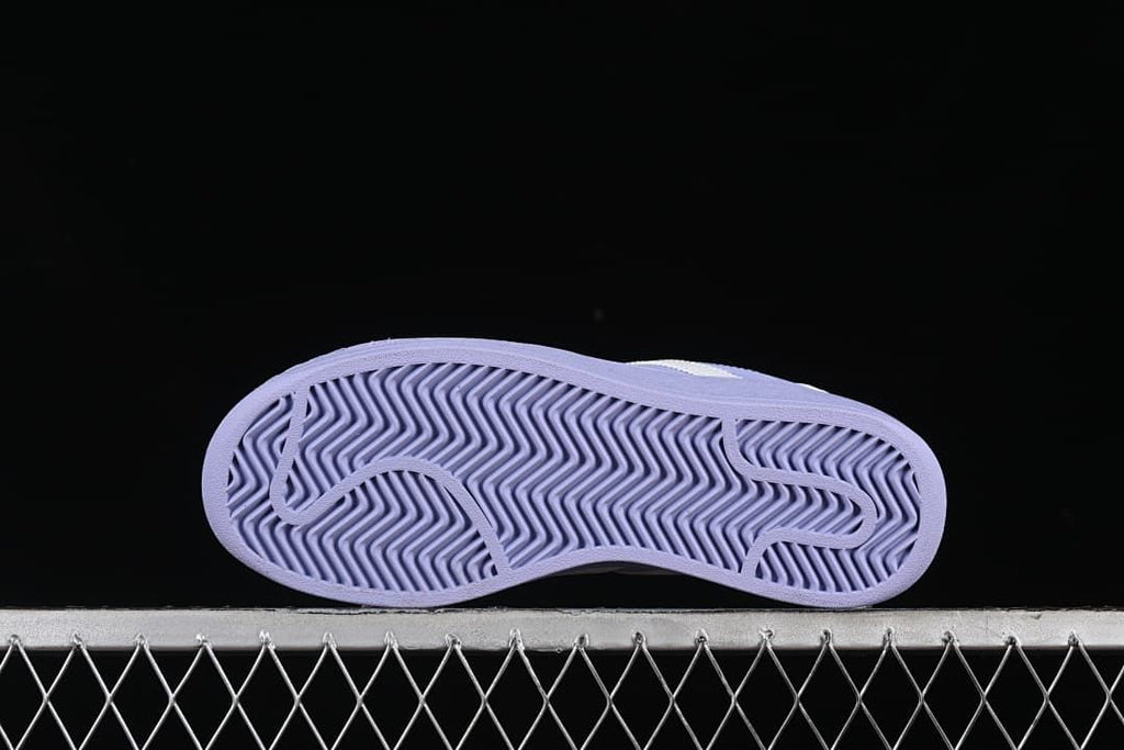 Underside view showing the patterned lavender outsole