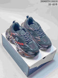 Pair of charcoal MLB NY sneakers with graphic accents displayed on a shoe box