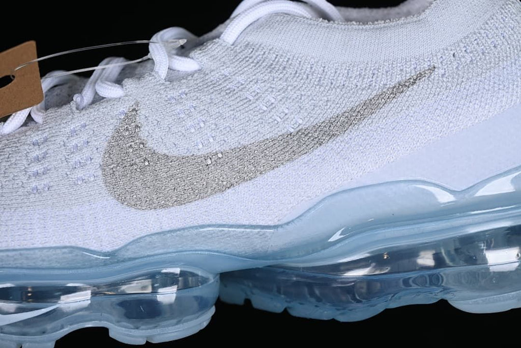 Close-up of the knit upper and metallic-look side Swoosh