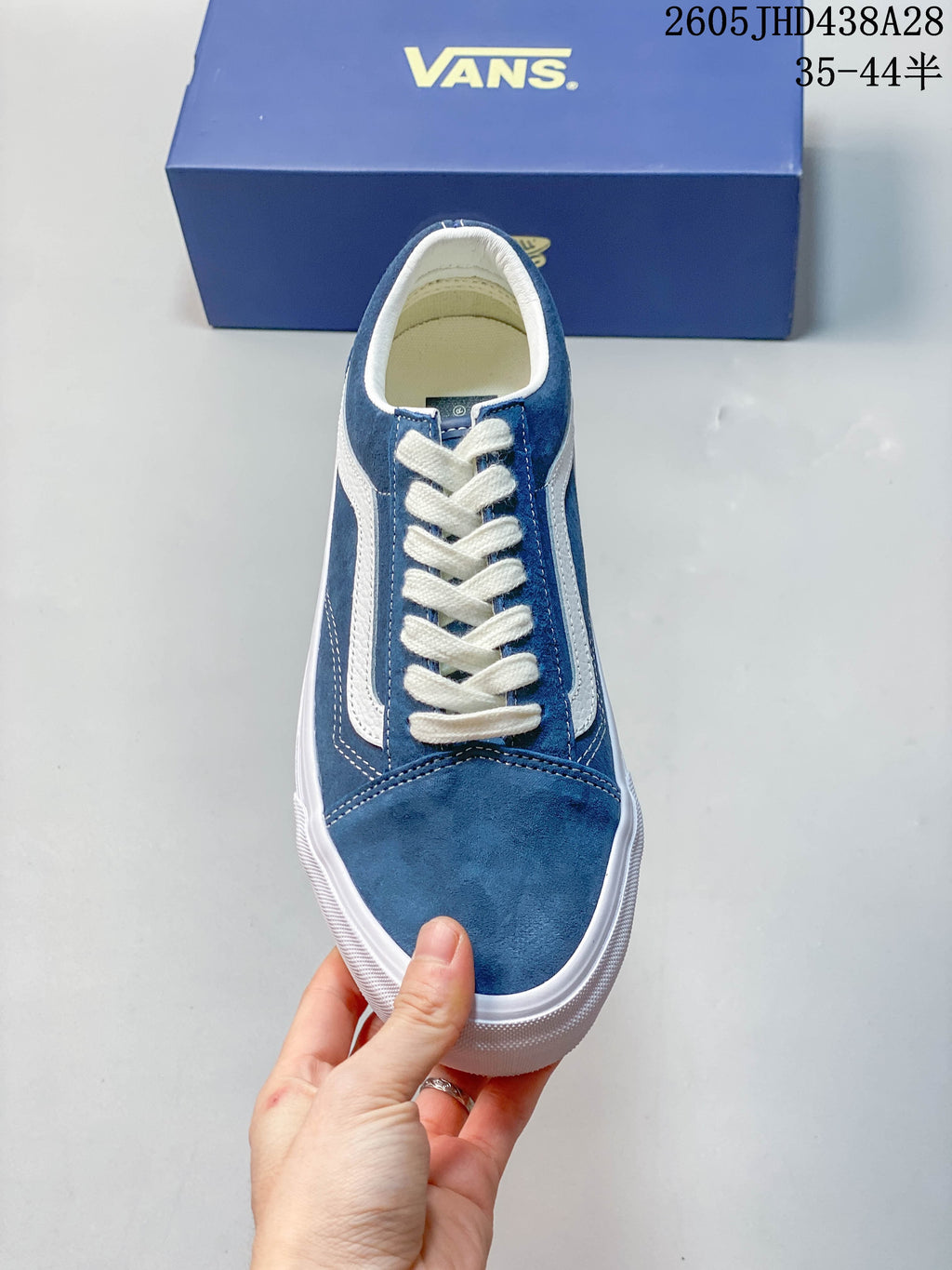 Top view of the blue sneaker showing its laces and toe