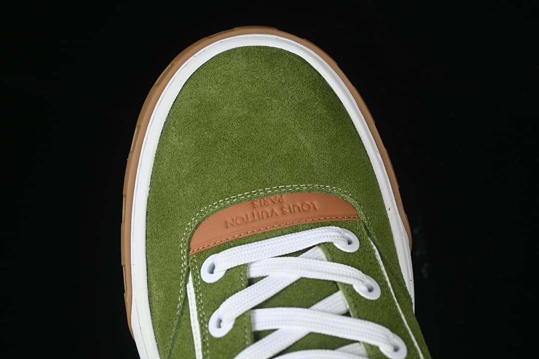Top view of the green rounded toe and white laces