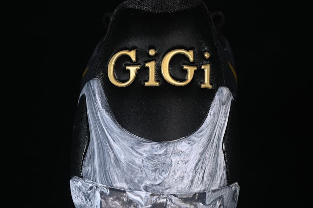 Rear view showing gold GiGi lettering and marbled heel detail