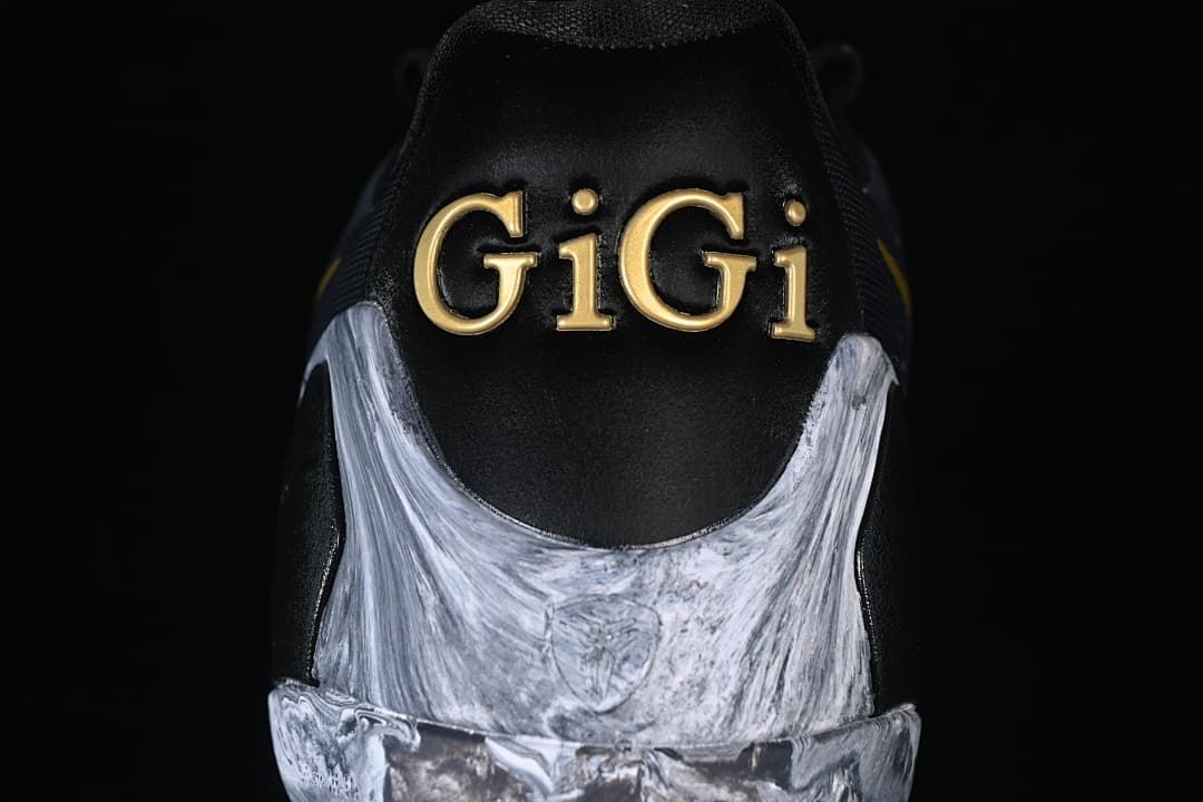 Rear view showing gold GiGi lettering and marbled heel detail
