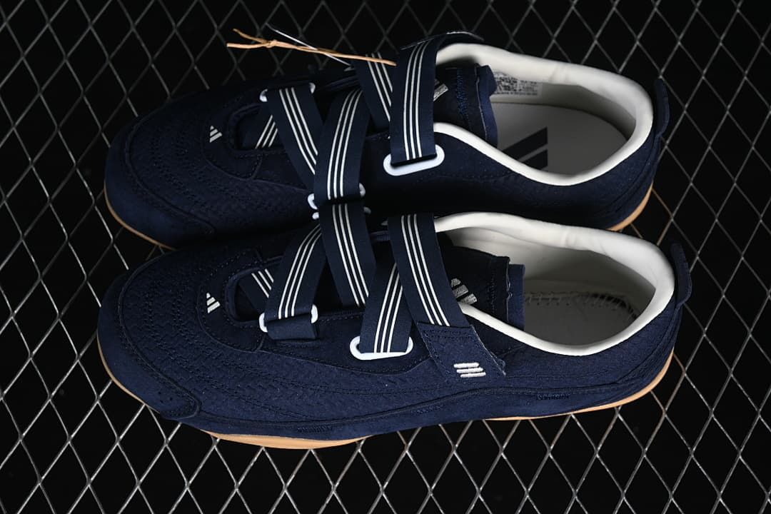 Pair of navy strap sneakers viewed from above.
