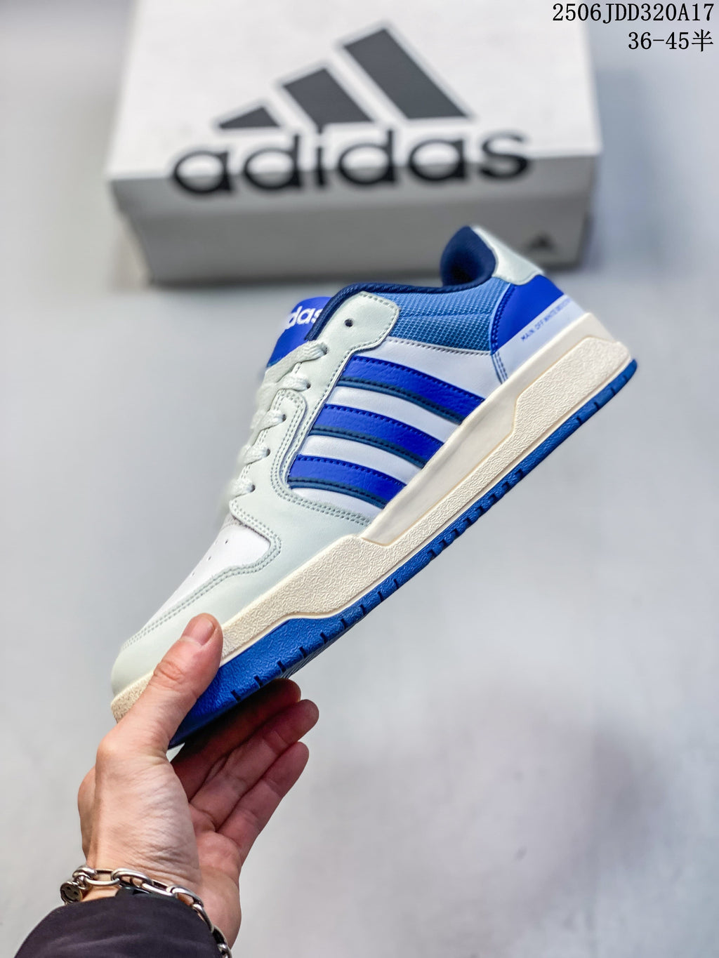 Side view showing three stripes and the blue outsole of the adidas Entrap sneaker