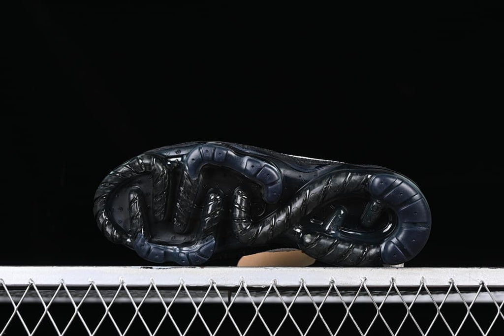 Underside view of the dark outsole.