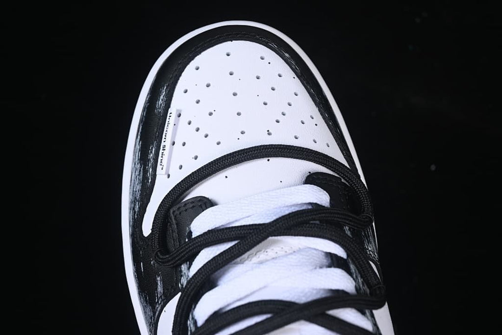 Top view of the perforated toe and layered laces
