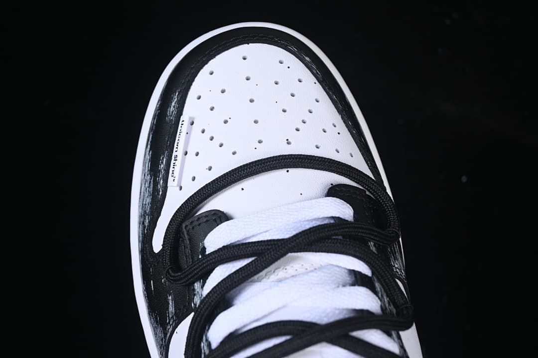Top view of the perforated toe and layered laces