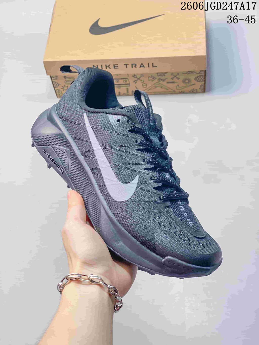 Dark gray Nike Wildhorse 10 trail running shoe with a light-colored side logo