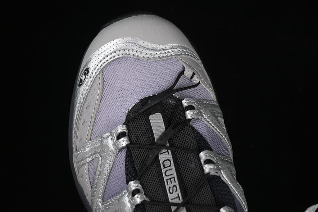 Top view of the toe, laces, and pale lavender panels