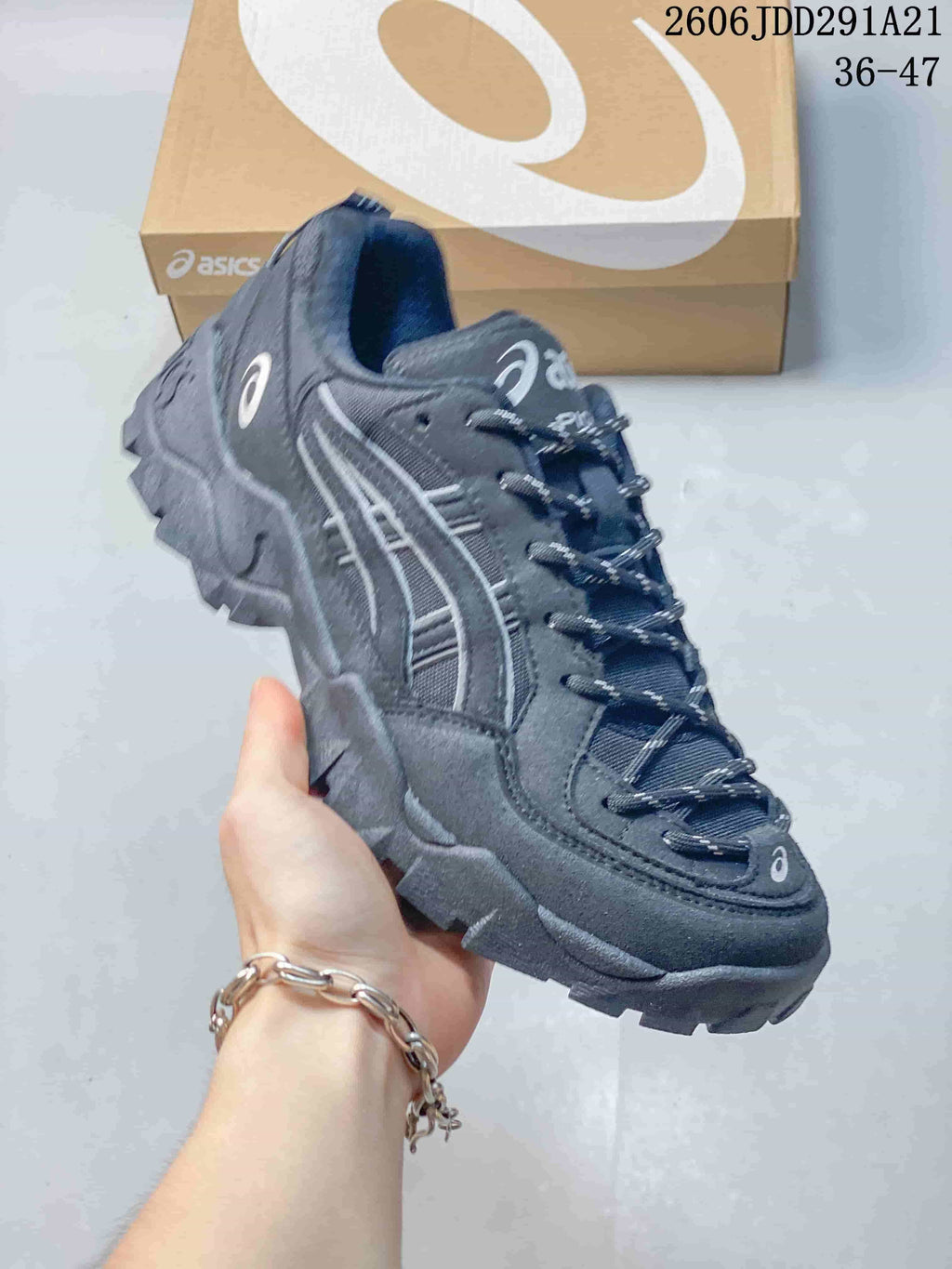 Dark charcoal ASICS GEL-PICKAX sneaker with matching laces and outsole.