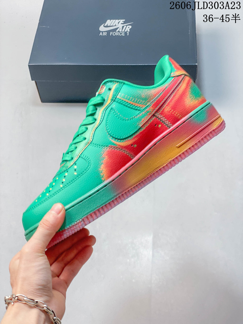 Side view showing the green upper, Nike Swoosh, and coral accents on the Air Force 1 sneaker