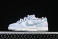 Side view of white and light blue Nike SB Dunk Low sneakers