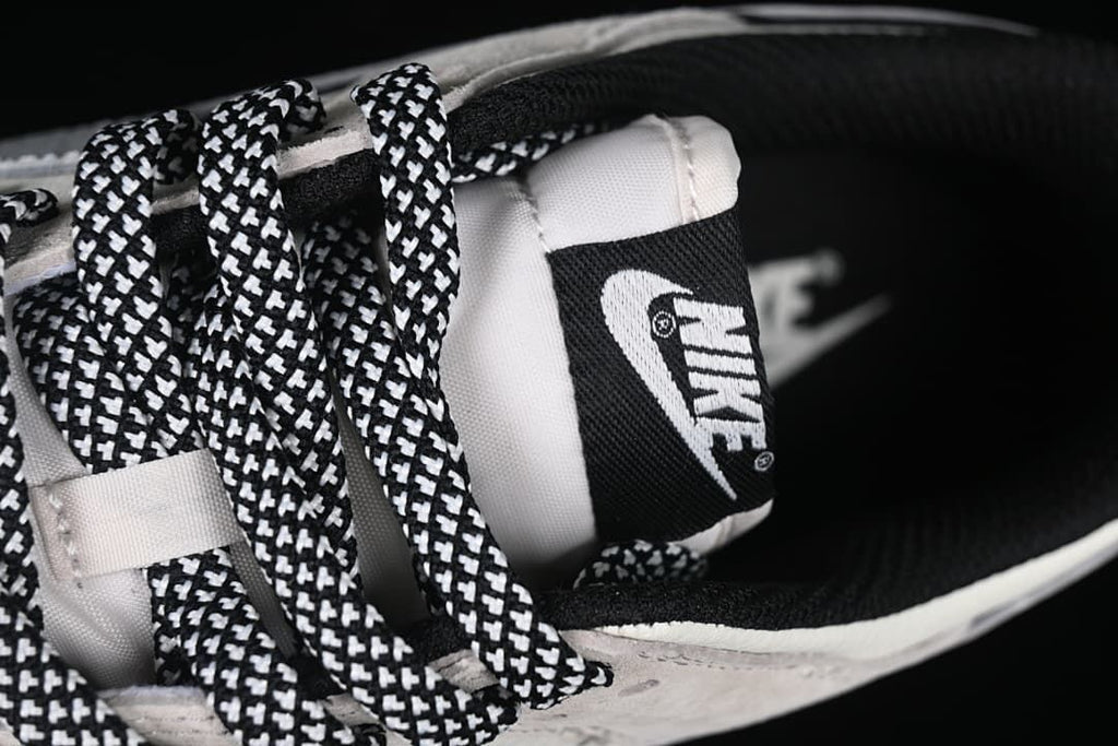 Close-up of the patterned laces, tongue label, and black collar lining