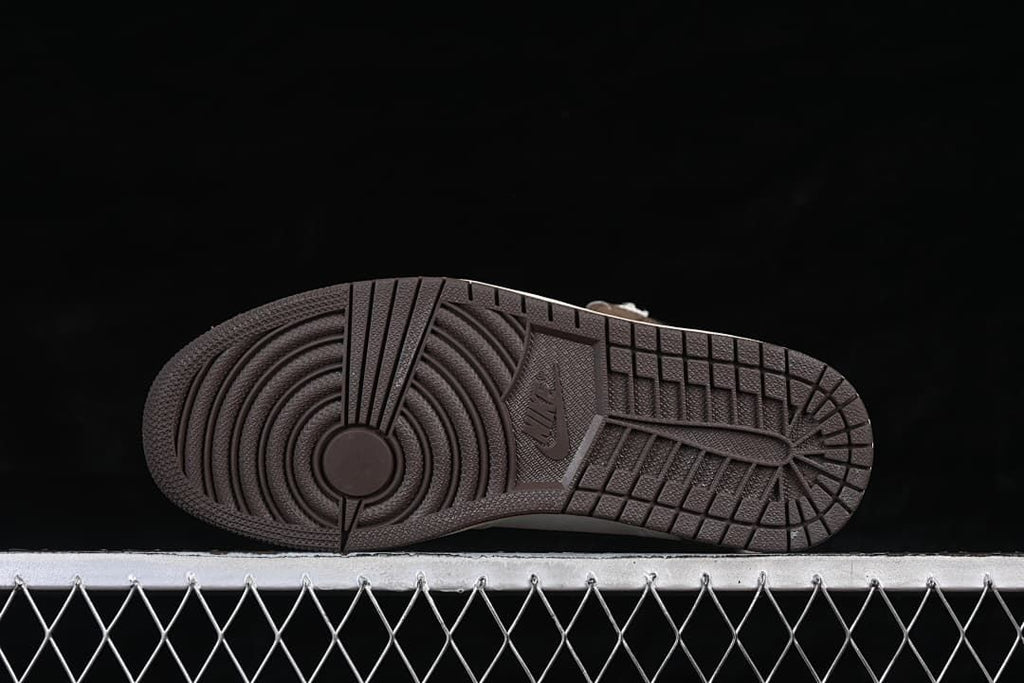 Underside view of the dark rubber outsole