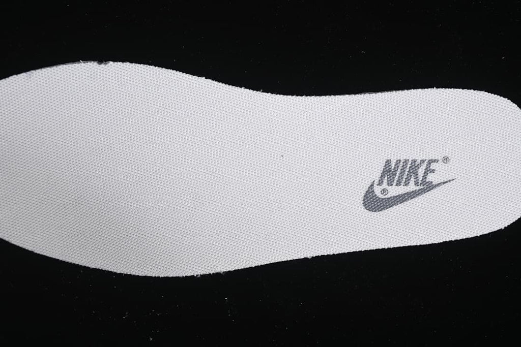 Close-up of a removable insole with a Nike logo