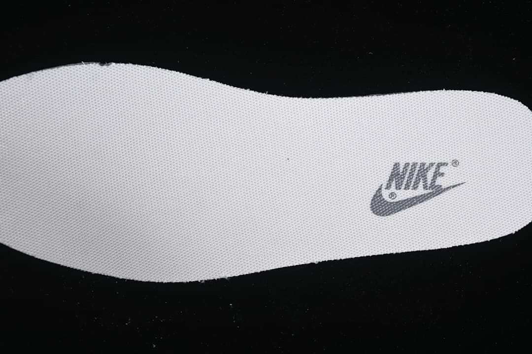 Close-up of a removable insole with a Nike logo