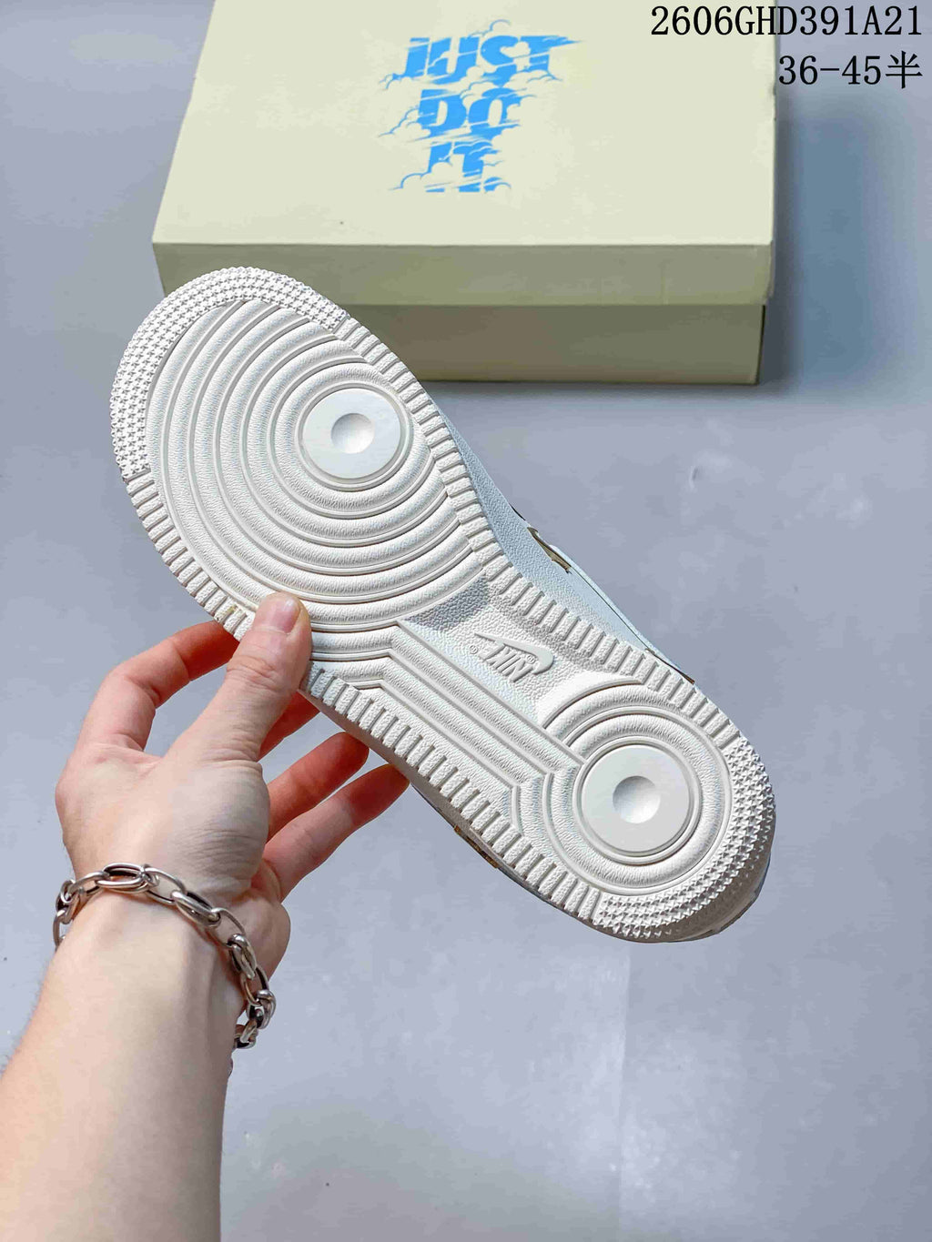 Underside view of the white textured outsole