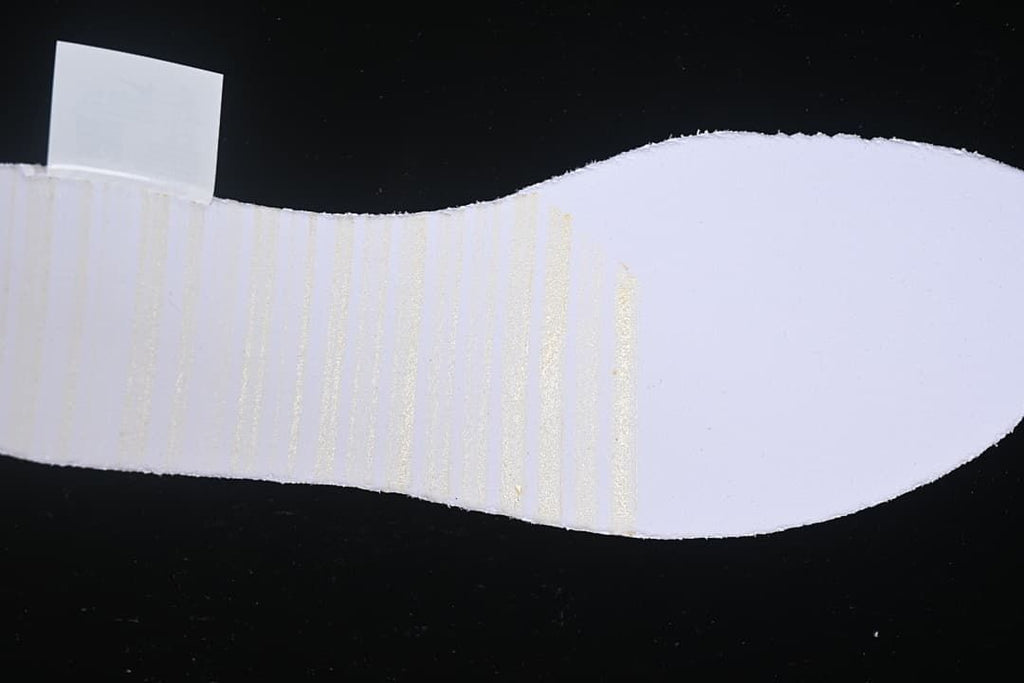 Close-up view of the shoe's pale sole surface.