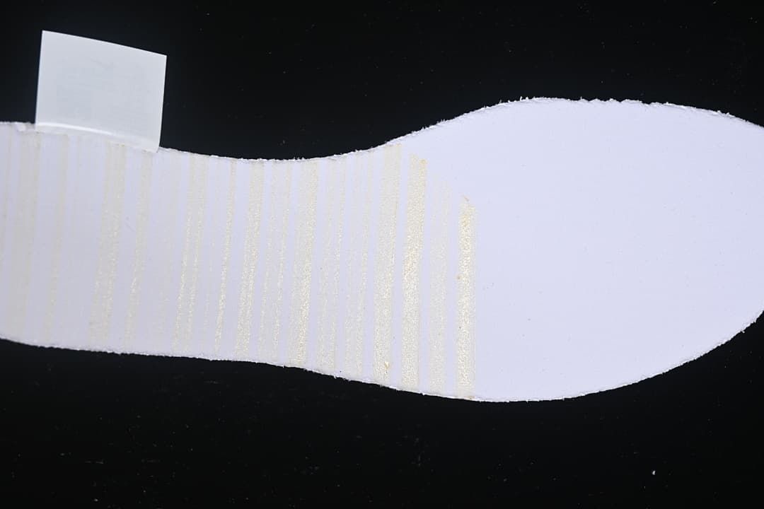 Close-up view of the shoe's pale sole surface.