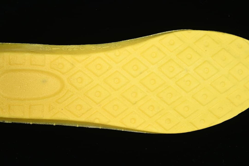 Close-up of the boot's yellow insole underside.