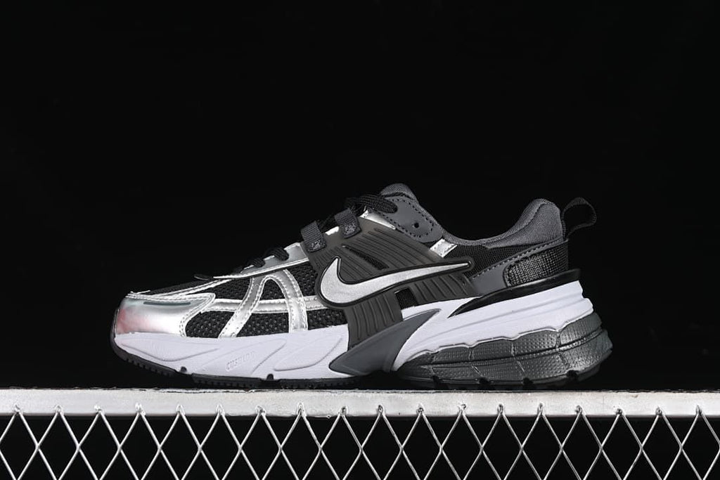 Nike V2K Run sneaker in black, silver, gray, and white, side view