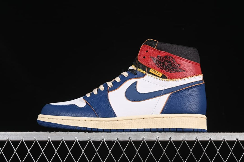 Side profile of the sneaker showing the color-blocked upper and high collar