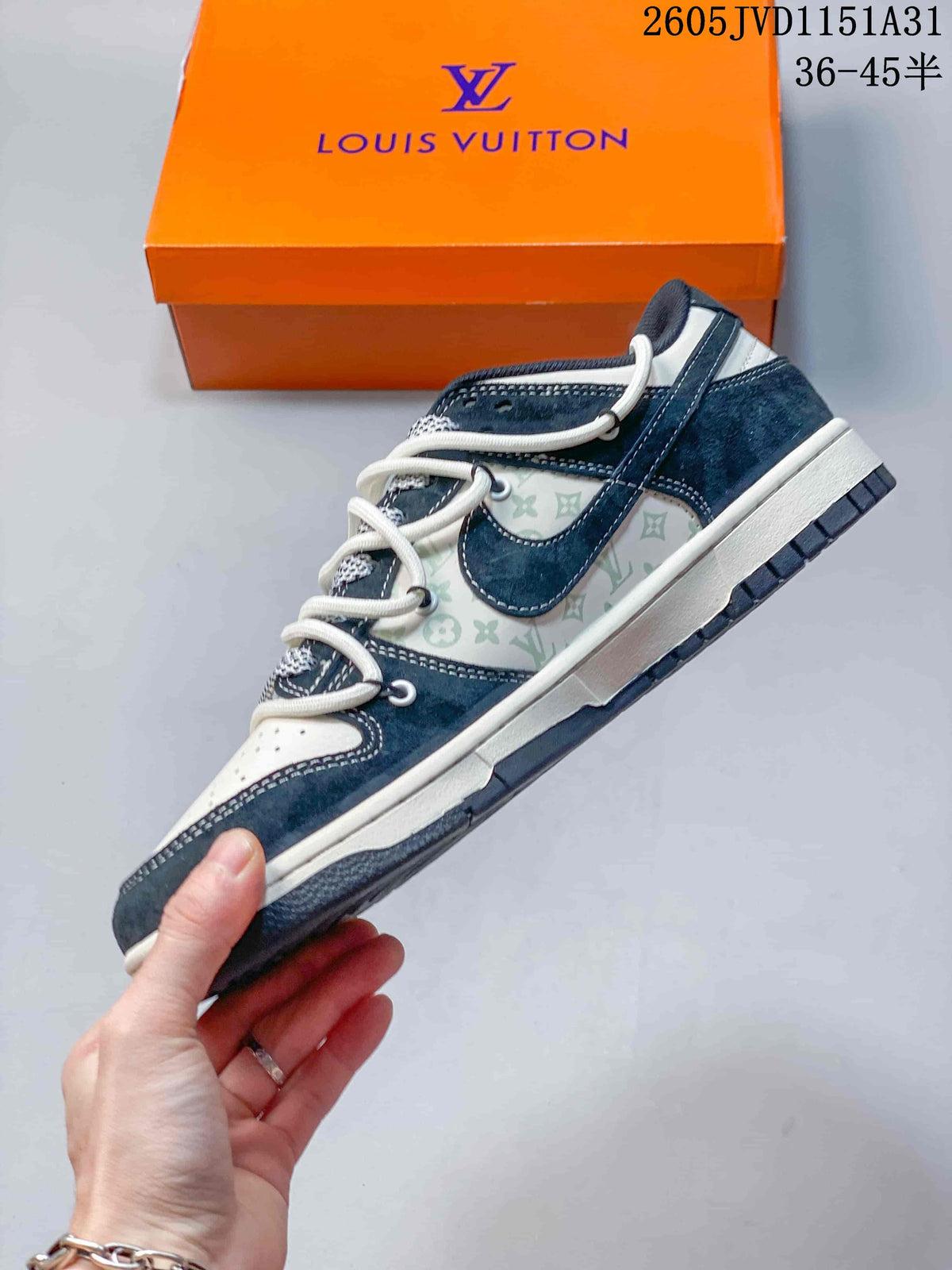 Side view of a navy and white low-top sneaker with patterned panels.